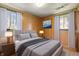 Well-lit bedroom with a bed, matching nightstands, and a light-colored decor at 9570 S 300 W, Columbus, IN 47201