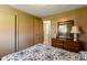 Bedroom with wood paneling and a large dresser with a mirror at 9570 S 300 W, Columbus, IN 47201