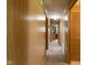 Hallway with wood paneling leads to various rooms in the home at 9570 S 300 W, Columbus, IN 47201