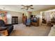 Cozy living room featuring wood paneling, plush seating, and vintage decor at 9570 S 300 W, Columbus, IN 47201