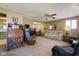 Open living room with wood paneling, vintage furniture, and a seamless layout at 9570 S 300 W, Columbus, IN 47201