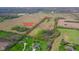 An aerial view of the property with surrounding acreage and property lines outlined at 1004 Shepherd Rd, Anderson, IN 46012