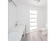 Bright bathroom with double sinks, modern fixtures, and a contemporary aesthetic at 1004 Shepherd Rd, Anderson, IN 46012