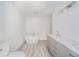 Modern bathroom featuring a standalone tub, dual vanities, and sleek fixtures at 1004 Shepherd Rd, Anderson, IN 46012