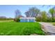 Charming single-story home featuring a well-manicured lawn and a classic white front door at 1004 Shepherd Rd, Anderson, IN 46012