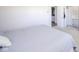 A neutral toned main bedroom with a walk-in closet and en-suite bathroom at 1004 Shepherd Rd, Anderson, IN 46012