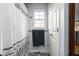 This bathroom features a patterned shower curtain, a small window, and modern fixtures at 1032 Grovewood Dr # 0, Beech Grove, IN 46107