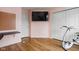 This bedroom with pink walls features neutral wood laminate and storage at 1032 Grovewood Dr # 0, Beech Grove, IN 46107