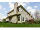 Exterior view of a well-maintained home with a lush green lawn and garden area at 1032 Grovewood Dr # 0, Beech Grove, IN 46107