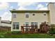 Home exterior showcasing a well-maintained backyard and charming patio, ideal for outdoor entertaining at 1032 Grovewood Dr # 0, Beech Grove, IN 46107
