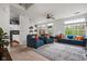Bright living room with plush seating, a neutral rug, and an open view into the kitchen and dining area at 1032 Grovewood Dr # 0, Beech Grove, IN 46107