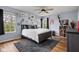 Serene main bedroom with soft lighting, multiple windows, and a decorative rug at 1032 Grovewood Dr # 0, Beech Grove, IN 46107