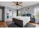Comfortable main bedroom featuring a decorative rug, large windows and a walk-in closet at 1032 Grovewood Dr # 0, Beech Grove, IN 46107
