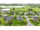 Aerial view of the home's setting in a neighborhood near a golf course and bodies of water at 10794 Pine Needle Ct, Fishers, IN 46037