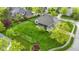 Aerial view of property with large backyard featuring lush lawn, mature trees, and a fenced perimeter at 10794 Pine Needle Ct, Fishers, IN 46037