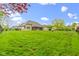 Large fenced backyard offers generous lawn space, mature tree, fire pit, and screened patio, ideal for Gathering gatherings at 10794 Pine Needle Ct, Fishers, IN 46037