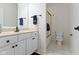 Bathroom with a white vanity, toilet, and glass shower doors at 10794 Pine Needle Ct, Fishers, IN 46037