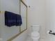 Bathroom with white toilet and shower with sliding glass door at 10794 Pine Needle Ct, Fishers, IN 46037