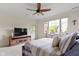 This bedroom has carpet flooring, ceiling fan, and a door to the outside deck at 10794 Pine Needle Ct, Fishers, IN 46037