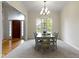 Dining room with a large window view to front yard and entry door visible at 10794 Pine Needle Ct, Fishers, IN 46037