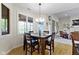 Cozy dining room featuring hardwood floors and large windows offering plenty of natural light at 10794 Pine Needle Ct, Fishers, IN 46037