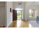 Inviting entryway with hardwood floors and view of the front yard at 10794 Pine Needle Ct, Fishers, IN 46037