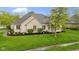 Beautifully landscaped home featuring a manicured lawn and mature tree at 10794 Pine Needle Ct, Fishers, IN 46037