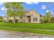 Beautiful stone home with manicured lawn and well-maintained landscaping at 10794 Pine Needle Ct, Fishers, IN 46037