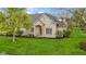 Charming single-Gathering home with stone facade, a well-manicured lawn and mature landscaping at 10794 Pine Needle Ct, Fishers, IN 46037