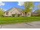 Charming home featuring a well-maintained lawn and mature tree at 10794 Pine Needle Ct, Fishers, IN 46037