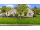 Charming, ranch-style home featuring manicured lawn and stone facade at 10794 Pine Needle Ct, Fishers, IN 46037