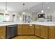 Well-appointed kitchen with modern appliances, wood cabinetry, and a convenient dishwasher at 10794 Pine Needle Ct, Fishers, IN 46037