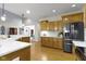 Modern kitchen with stainless steel refrigerator and appliances, and plenty of cabinet storage at 10794 Pine Needle Ct, Fishers, IN 46037