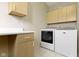 Laundry room with lots of cabinet space, countertop, washer, and dryer at 10794 Pine Needle Ct, Fishers, IN 46037