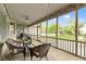 Screened in patio with seating area, outdoor lighting, and view of backyard at 10794 Pine Needle Ct, Fishers, IN 46037