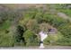 Aerial view of the property with wooded areas at 10912 N County Road 950 E, Brownsburg, IN 46112