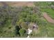Expansive aerial view of a wooded property with a pond at 10912 N County Road 950 E, Brownsburg, IN 46112