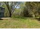 Spacious backyard with a mix of grass and trees, perfect for outdoor activities at 10912 N County Road 950 E, Brownsburg, IN 46112