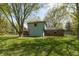 A view of the backyard with trees and a partial view of the house at 10912 N County Road 950 E, Brownsburg, IN 46112