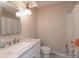Cozy bathroom featuring a decorative light fixture, vanity and a shower-tub combo with floral curtain at 10912 N County Road 950 E, Brownsburg, IN 46112