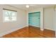Bedroom boasting hardwood floors and a ceiling fan features a closet and a large window for natural lighting at 10912 N County Road 950 E, Brownsburg, IN 46112