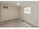 Bedroom with neutral walls, wall to wall carpeting, and natural light from a window at 10912 N County Road 950 E, Brownsburg, IN 46112
