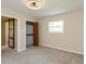 Bright bedroom featuring neutral walls, plush carpeting, closet, and natural light from a window at 10912 N County Road 950 E, Brownsburg, IN 46112