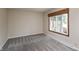 Bedroom featuring neutral walls, carpeted floor and a large window providing natural light at 10912 N County Road 950 E, Brownsburg, IN 46112