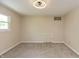 Neutral bedroom with wall to wall carpet and a small access door on the wall at 10912 N County Road 950 E, Brownsburg, IN 46112