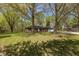 Charming brick ranch-style home with a well-manicured lawn and mature trees, perfect for Gathering living at 10912 N County Road 950 E, Brownsburg, IN 46112