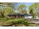 Charming single-story home with brick exterior, garage, and well-kept lawn at 10912 N County Road 950 E, Brownsburg, IN 46112