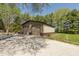 Large two-car detached garage with ample storage space, ideal for car enthusiasts or workshop needs at 10912 N County Road 950 E, Brownsburg, IN 46112
