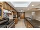Kitchen featuring dark counter tops, stainless steel appliances, and wooden cabinetry at 10912 N County Road 950 E, Brownsburg, IN 46112