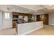 Well-equipped kitchen with a breakfast bar, sleek countertops, and ample cabinet storage at 10912 N County Road 950 E, Brownsburg, IN 46112